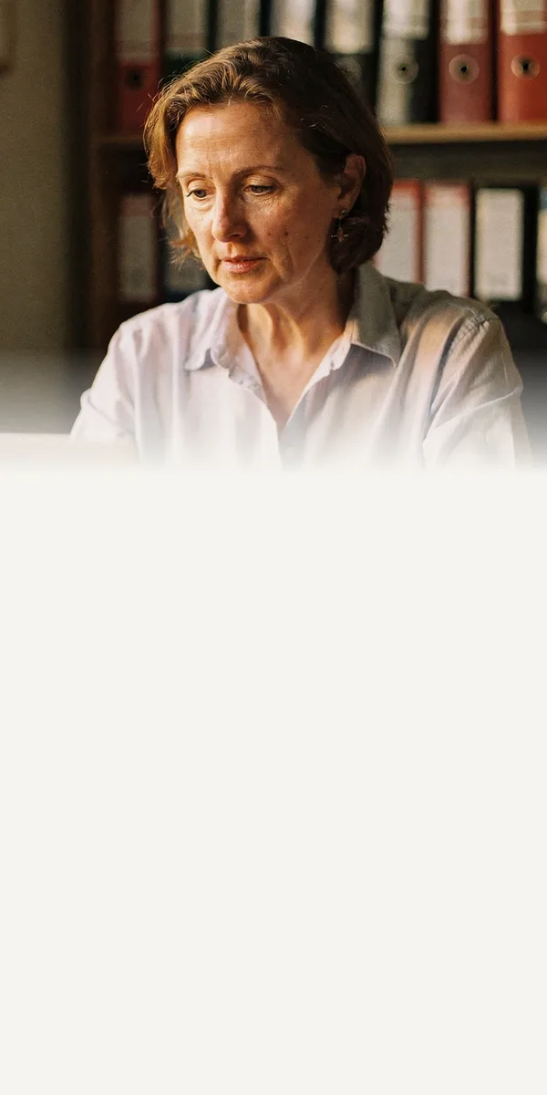 Generated photograph of a care home manager working at her desk